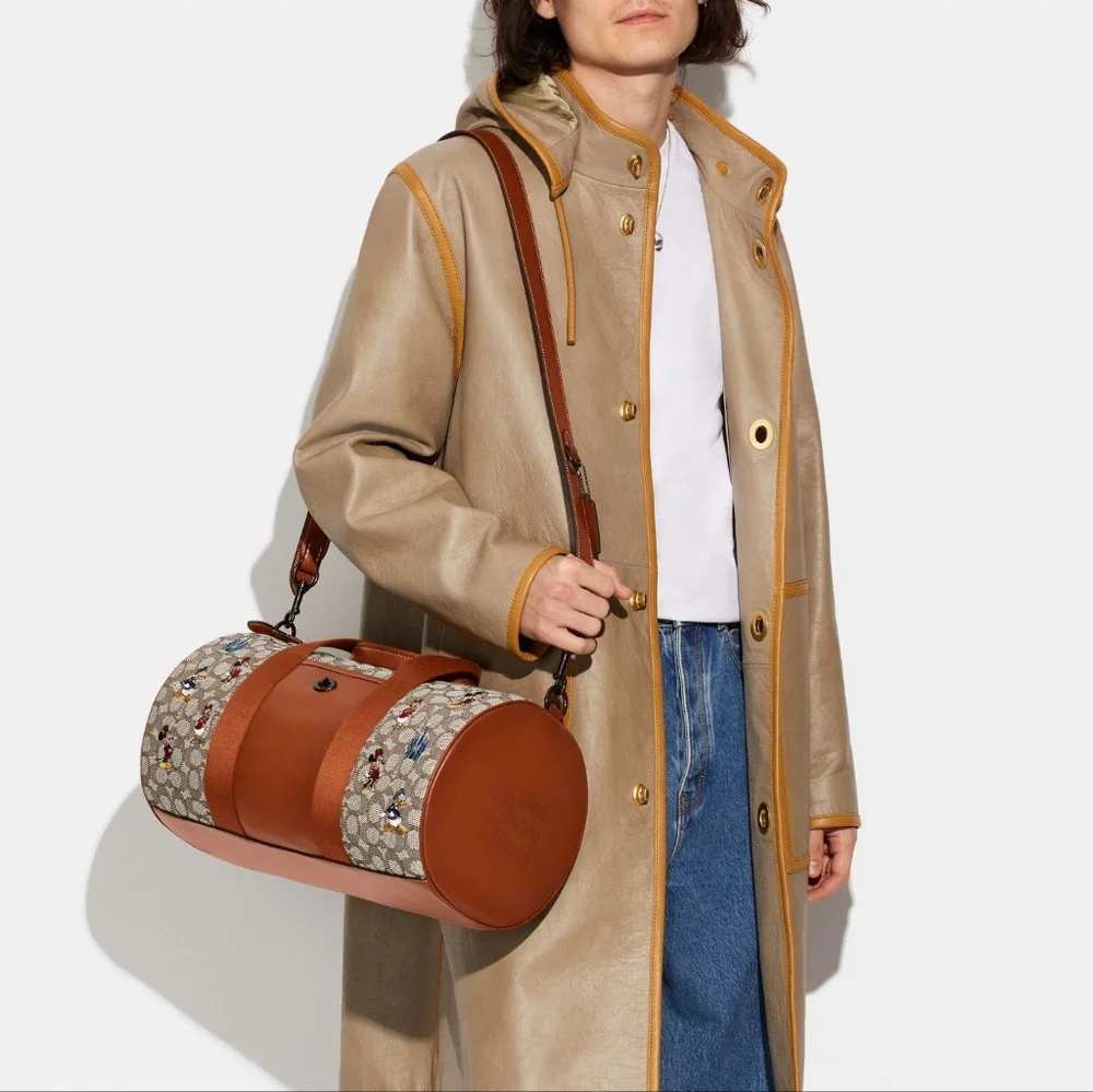 DISNEY X COACH DUFFLE BAG - SIGNATURE TEXTILE JACQUARD MICKEY MOUSE AND FRIENDS